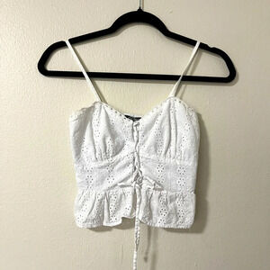 Wild fable size XXS White eyelet crop top adjustable straps and tie in the front